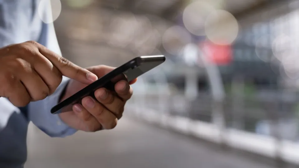 Business professional using mobile phone for work calls
